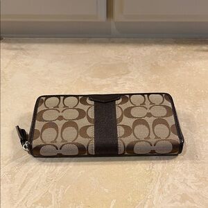 Coach Signature Stripe Accordion Zip Around Wallet in brown and tan